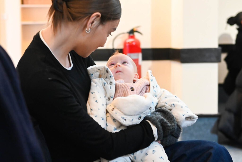 An Image of a mother speaking to her small baby at New Life Church Battersea, a local church in Battersea